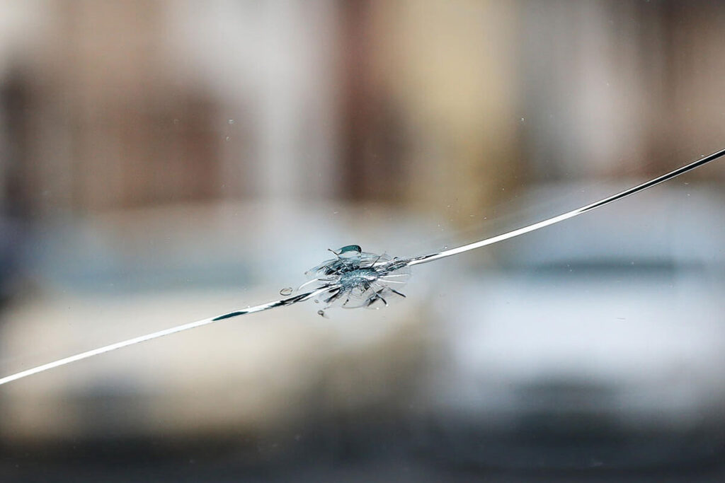 showing big ship in a windshield with a crack spreading