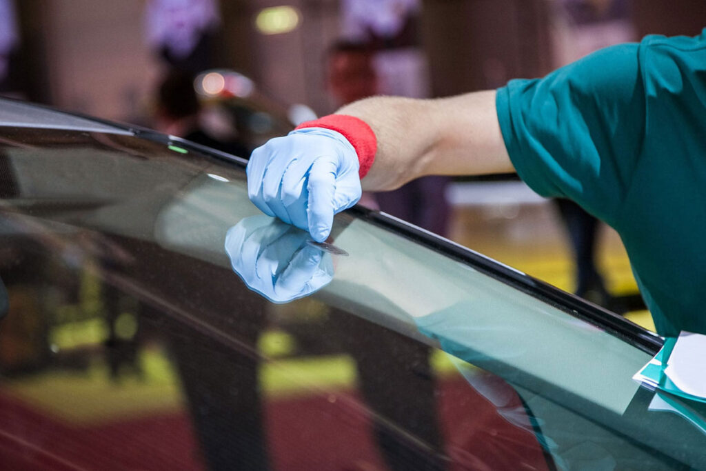 Windshield repair process using tools to fix a small rock chip