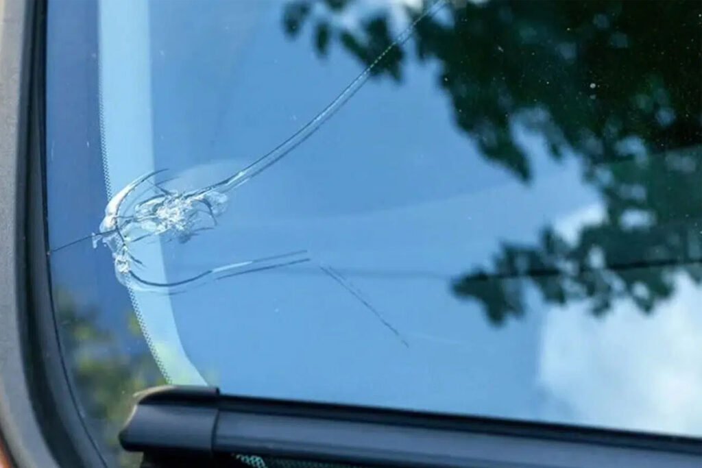 A large chip and crack on a winshield